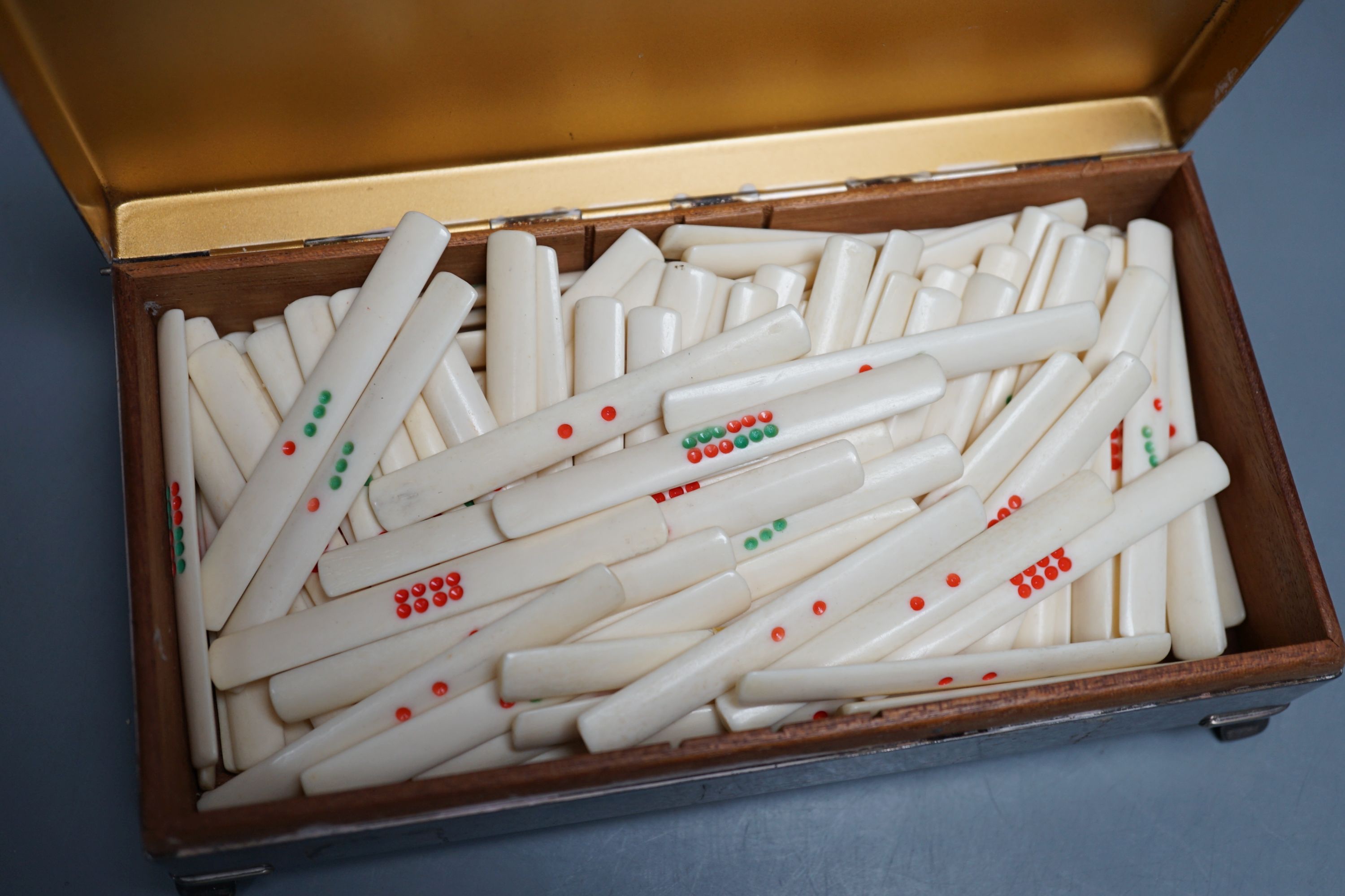 Bone set game markers, in a plated box.